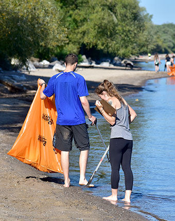People cleaning up a local beach