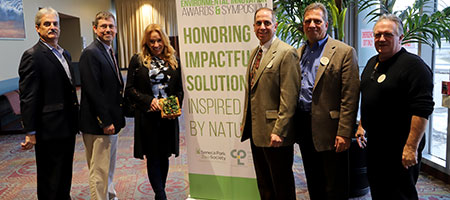 Environmental Innovation Award winners smiling at the camera