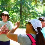 People on a nature hike led by a Zoo Naturalist
